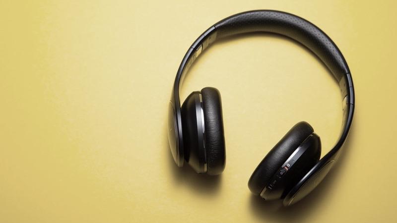 Over-the-ear headphones on a yellow background