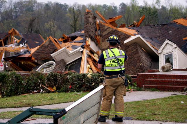 Firefighter surveys damage after Alabama tornado 